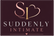 A digital logo graphic for 'Suddenly Intimate' featuring a stylized 'SI' monogram with a heart outline in rose gold and gold, above the text 'SUDDENLY INTIMATE' in white and rose gold on a dark maroon background.