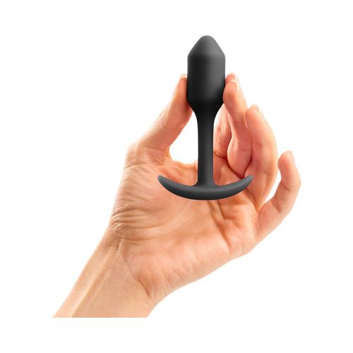 Weighted black silicone anal plug with flared base and curved handle
