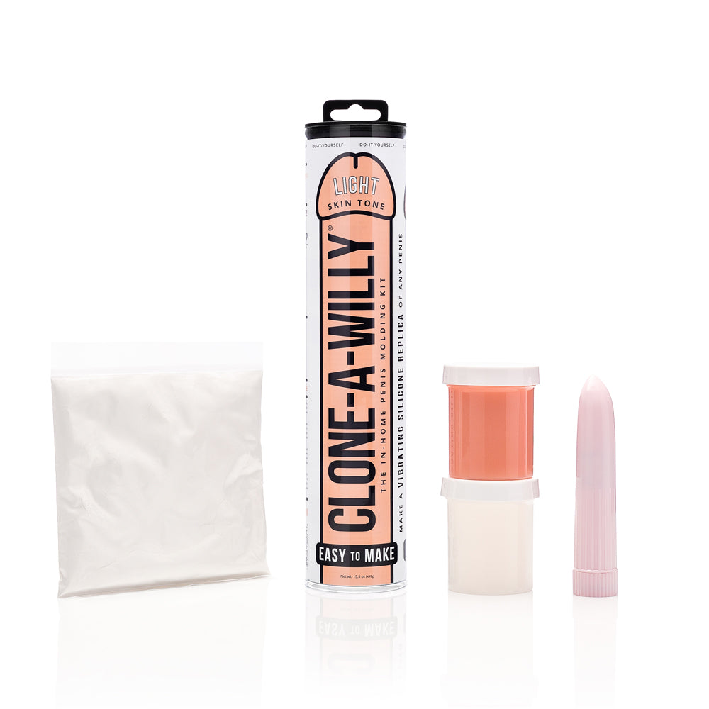 DIY vibrating dildo kit with light skin tone mold parts and pink insert
