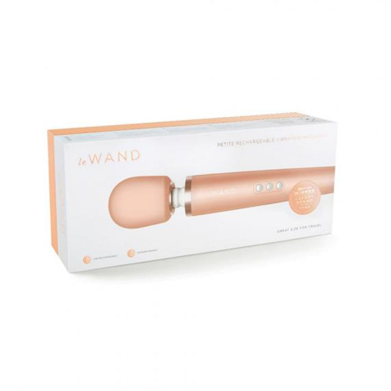 Petite rechargeable vibrating massager with rose gold handle and silicone tip