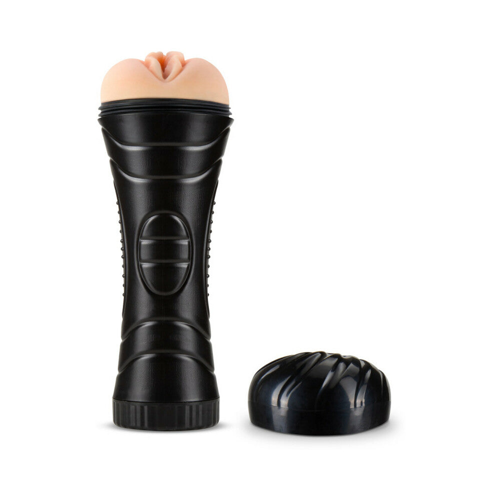 Black pleasure toy handle with beige top insert; product and cap shown together.