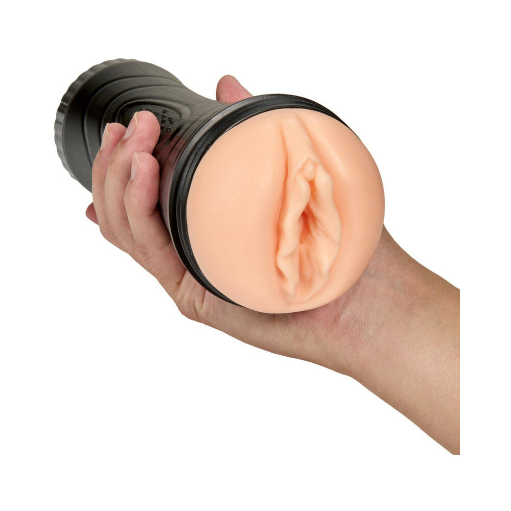 Black sex toy with beige realistic insert sleeve, shown being held from side.