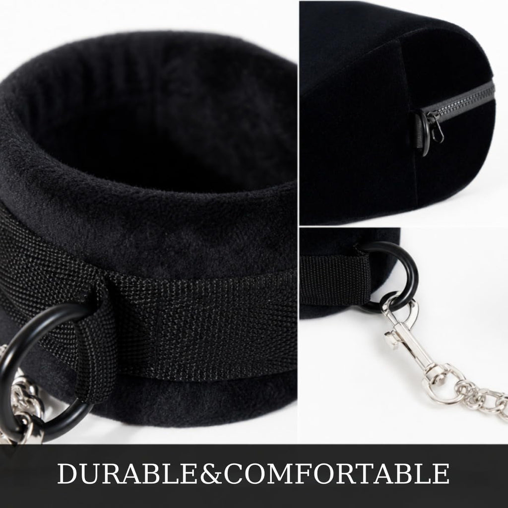 Black cuffs with metal ring, zipper closure, and chain connector