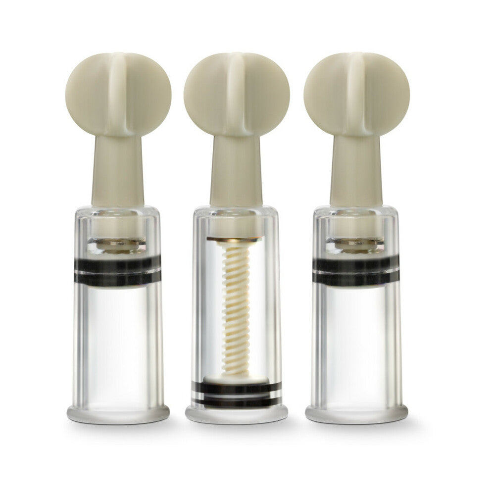 Three clear cylinder twist suction devices with pale silicone suction heads.
